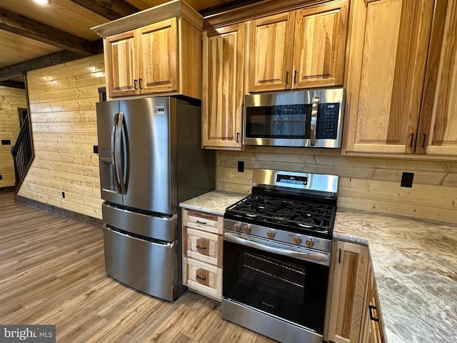 152 Susan Ln, Stanley, VA 22851 - kitchen featuring appliances with stainless steel finishes, light wood-type flooring, wooden walls, wood ceiling, and beamed ceiling