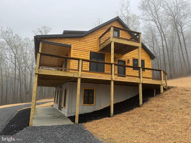 152 Susan Ln, Stanley, VA 22851 - back of property with faux log siding and a deck