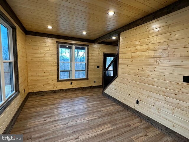 152 Susan Ln, Stanley, VA 22851 - unfurnished room with wooden walls, wood finished floors, wood ceiling, recessed lighting, and stairway