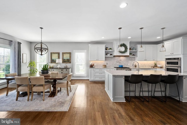 10605 Springvale Ln, Spotsylvania, VA 22551 - kitchen with open shelves, double oven, healthy amount of natural light, tasteful backsplash, and recessed lighting