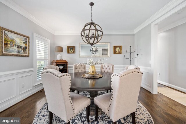 10605 Springvale Ln, Spotsylvania, VA 22551 - dining area with a chandelier, crown molding, dark wood-style flooring, and a wainscoted wall