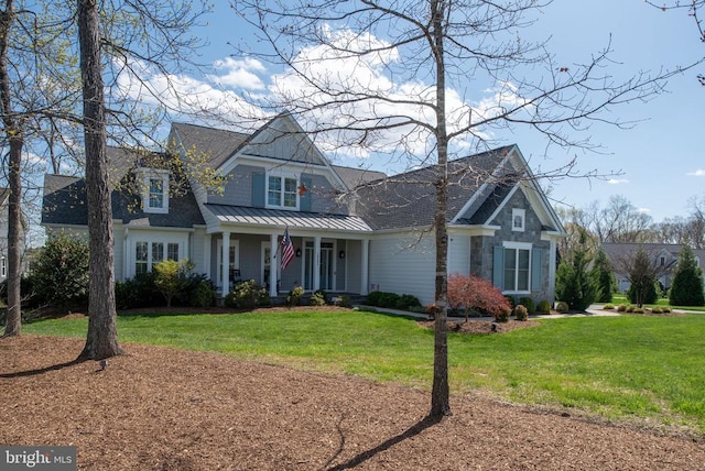 10605 Springvale Ln, Spotsylvania, VA 22551 - view of front facade featuring a porch, a front lawn, a standing seam roof, and metal roof