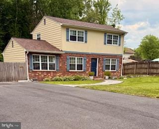 view of front of house with brick siding