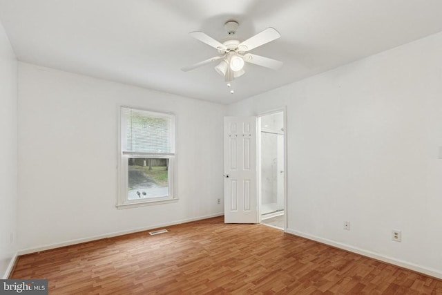 10804 Cobblestone Dr, Spotsylvania, VA 22553 - unfurnished bedroom featuring wood finished floors, ensuite bathroom, and a ceiling fan