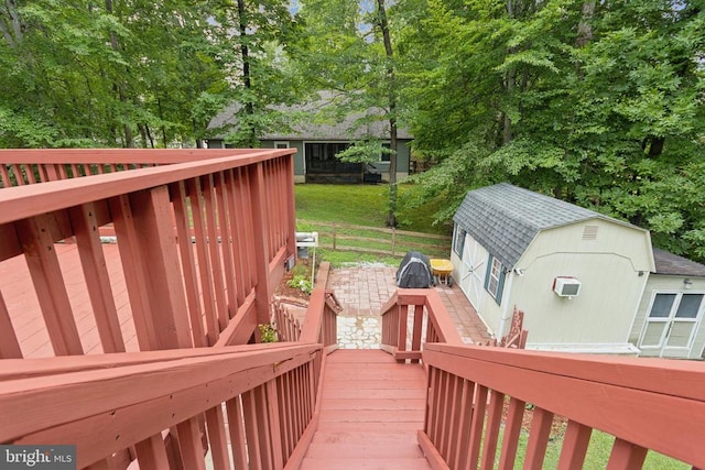 10804 Cobblestone Dr, Spotsylvania, VA 22553 - deck with a wall mounted air conditioner and view of scattered trees