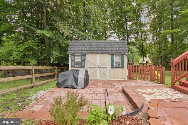 10804 Cobblestone Dr, Spotsylvania, VA 22553 - view of shed with a fenced backyard and view of wooded area