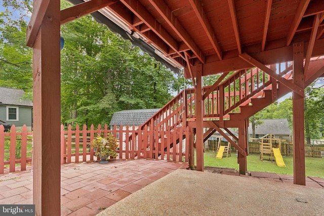 10804 Cobblestone Dr, Spotsylvania, VA 22553 - fenced backyard featuring a playground, a patio, and stairway