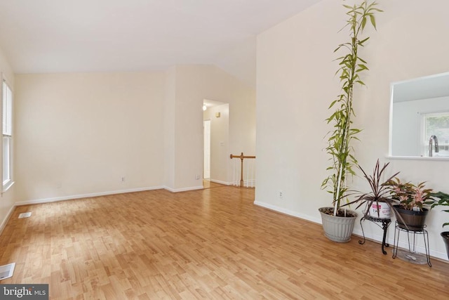 10804 Cobblestone Dr, Spotsylvania, VA 22553 - unfurnished living room with light wood-style floors and lofted ceiling