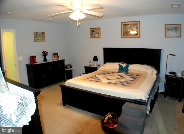  - bedroom featuring light carpet and a ceiling fan