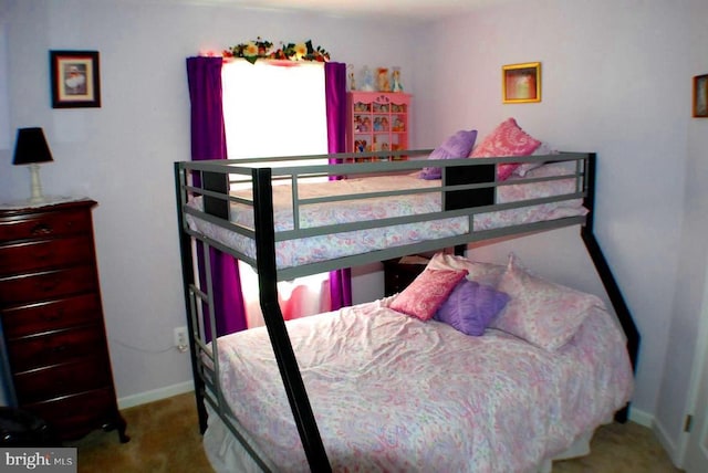  - carpeted bedroom featuring baseboards