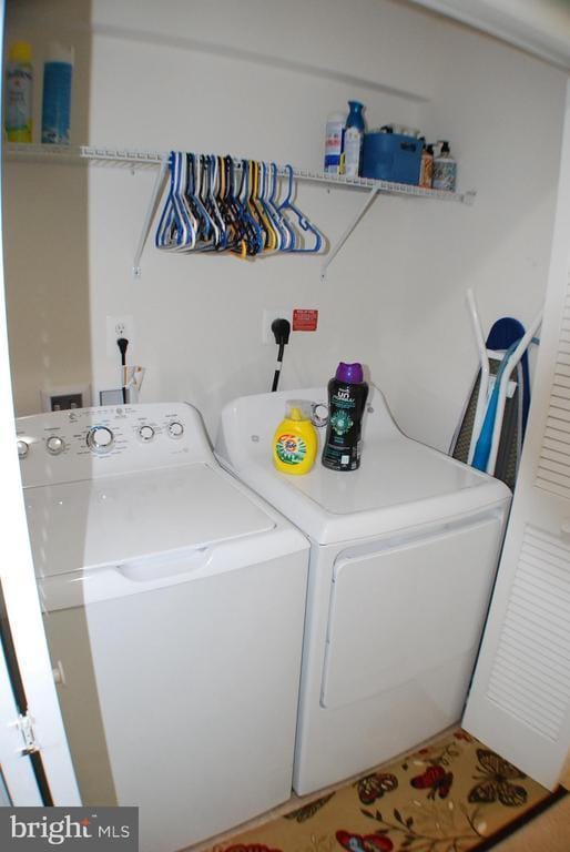  - laundry area featuring washing machine and dryer