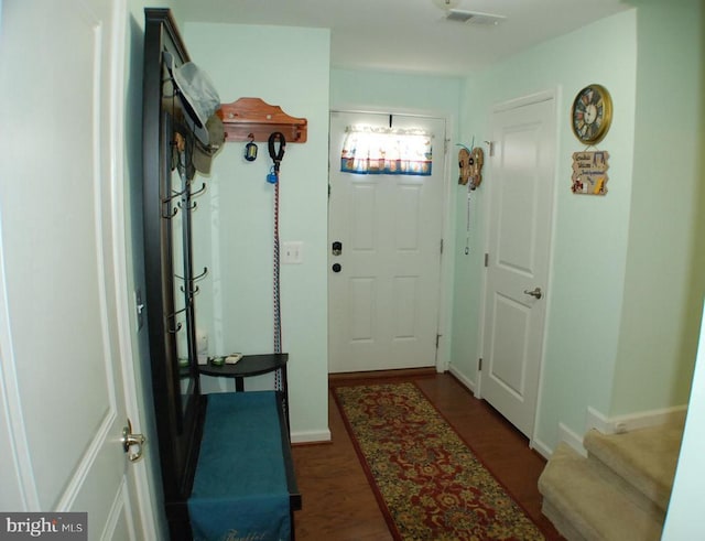  - doorway featuring dark wood-style floors and stairway