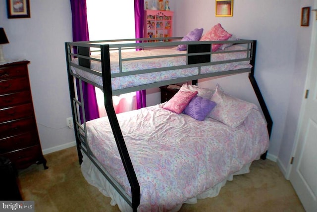  - carpeted bedroom with baseboards