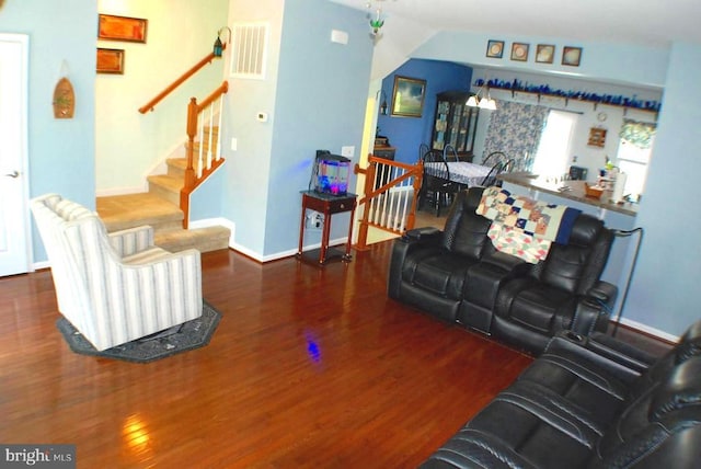  - living area with wood finished floors and stairs