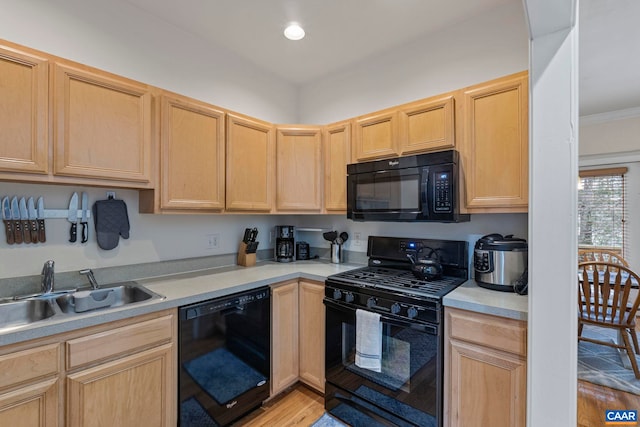1103 Druid Ave Unit D, Charlottesville, VA 22902 - kitchen with black appliances, a sink, light brown cabinets, and light wood finished floors