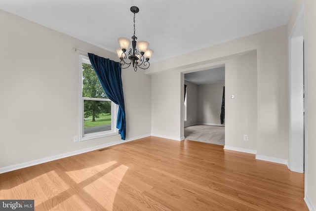 17417 Hawthorne Ave, Culpeper, VA 22701 - empty room featuring a chandelier and light wood-type flooring