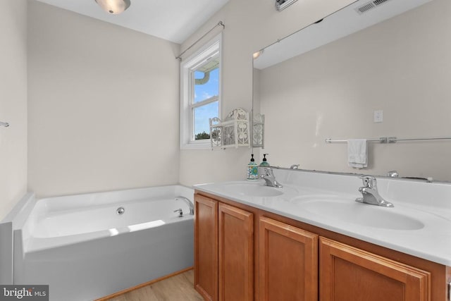 17417 Hawthorne Ave, Culpeper, VA 22701 - full bath with double vanity, a bath, and wood finished floors