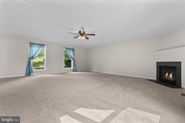 17417 Hawthorne Ave, Culpeper, VA 22701 - unfurnished living room with carpet, ceiling fan, and a fireplace with flush hearth