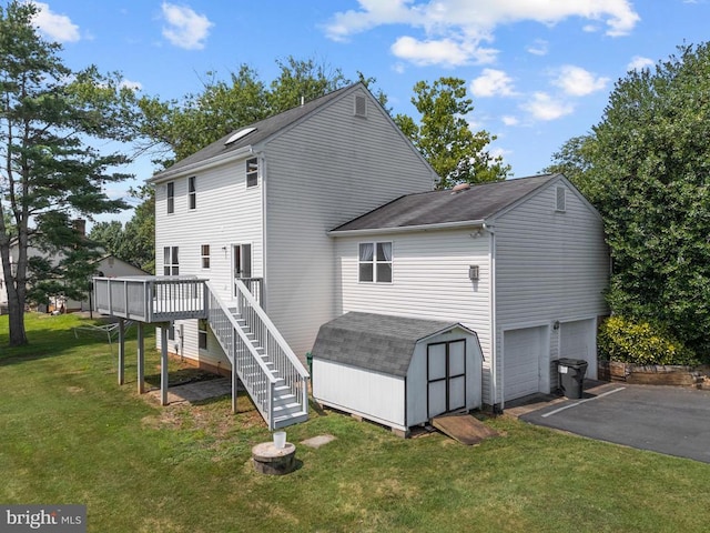 17417 Hawthorne Ave, Culpeper, VA 22701 - back of property with a garage, stairway, a storage shed, driveway, and a wooden deck