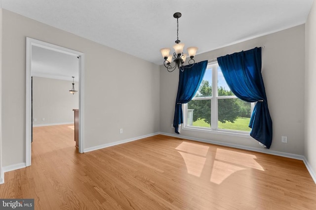17417 Hawthorne Ave, Culpeper, VA 22701 - spare room featuring a chandelier and wood finished floors