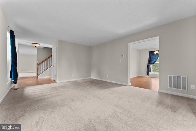 17417 Hawthorne Ave, Culpeper, VA 22701 - unfurnished room featuring carpet, stairway, and a chandelier