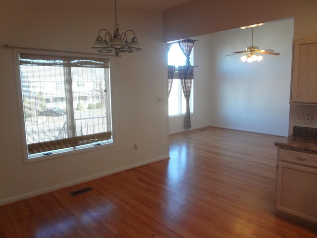 1317 Goldfinch Dr, Harrisonburg, VA 22802 - unfurnished dining area featuring light wood-type flooring, a chandelier, and baseboards