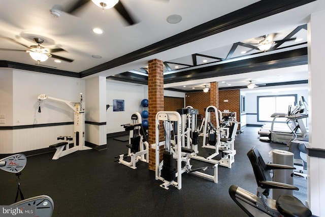 gym featuring a ceiling fan, ornate columns, ornamental molding, and recessed lighting
