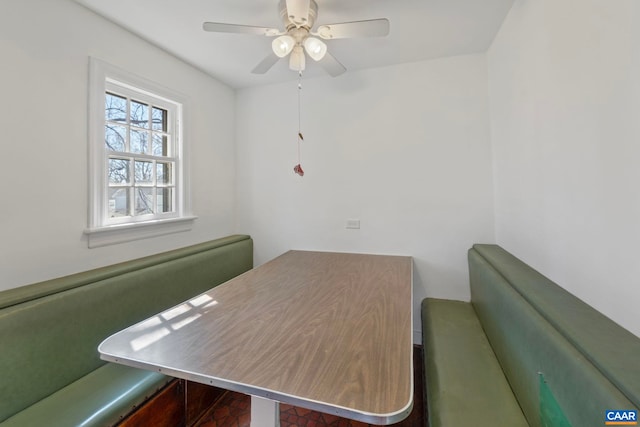 unfurnished dining area featuring ceiling fan