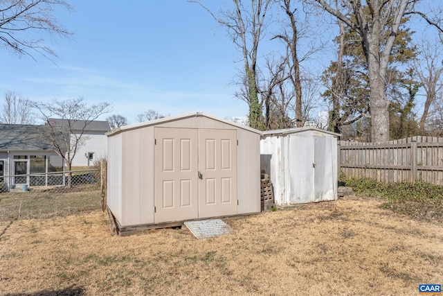 view of shed featuring a fenced backyard