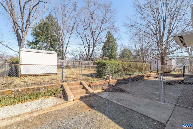 view of yard with fence and a gate