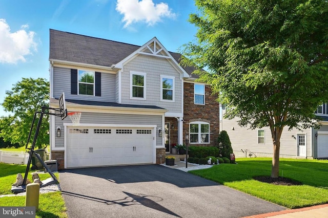 2033 Magnolia Cir, Culpeper, VA 22701 - view of front facade featuring stone siding, asphalt driveway, a garage, and a front lawn