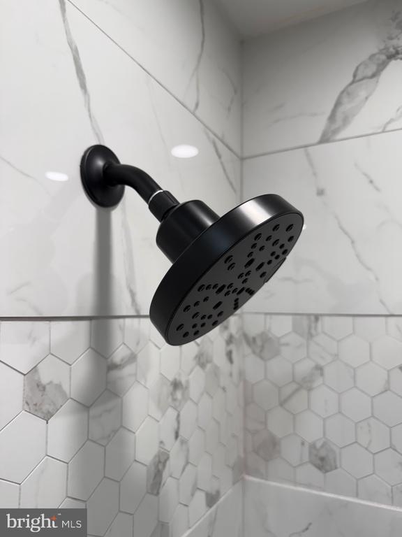 bathroom view of tiled shower