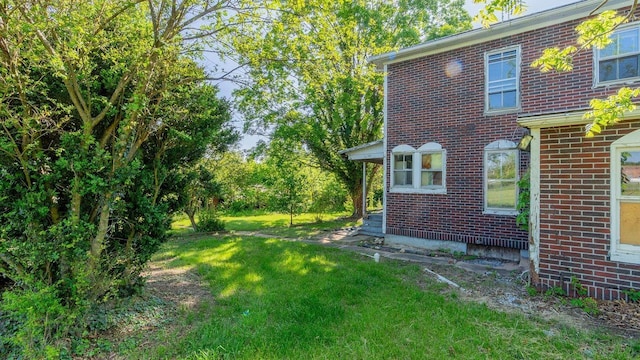 506 Williams Ave, Shenandoah, VA 22849 - view of property exterior featuring brick siding and a lawn