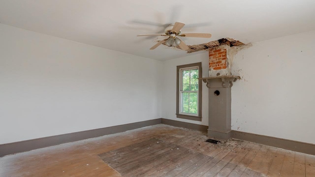 506 Williams Ave, Shenandoah, VA 22849 - unfurnished room with hardwood / wood-style floors, baseboards, and a ceiling fan