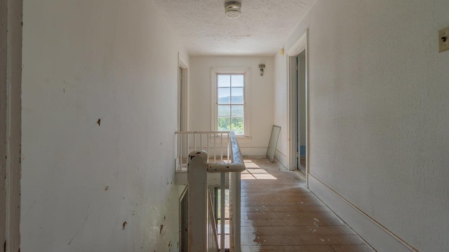 506 Williams Ave, Shenandoah, VA 22849 - corridor with a textured ceiling, hardwood / wood-style floors, and baseboards