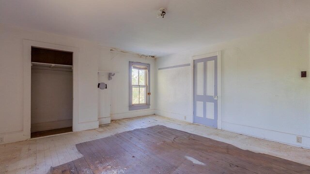 506 Williams Ave, Shenandoah, VA 22849 - unfurnished bedroom with hardwood / wood-style floors and baseboards