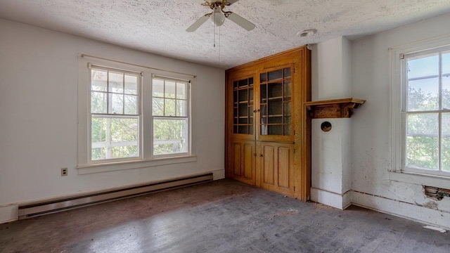 506 Williams Ave, Shenandoah, VA 22849 - empty room featuring a baseboard radiator, wood finished floors, ceiling fan, and a textured ceiling