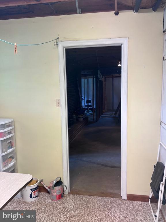  - hallway featuring concrete flooring