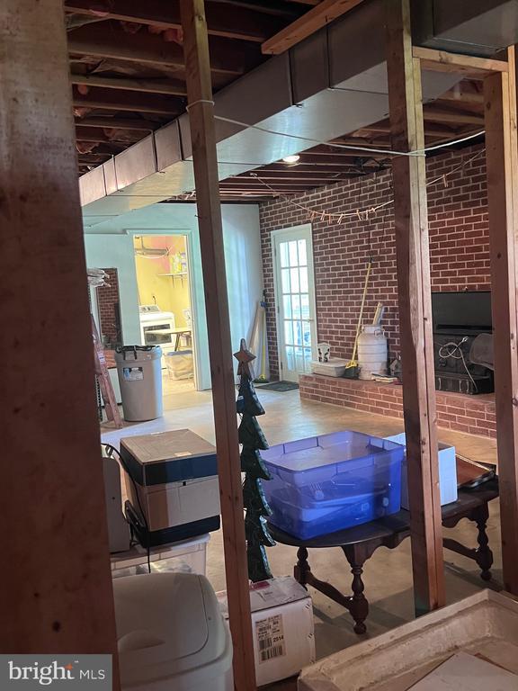  - misc room featuring brick wall