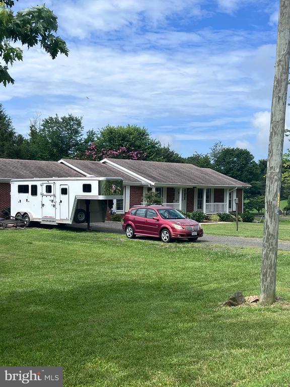  - view of front of home featuring a front lawn