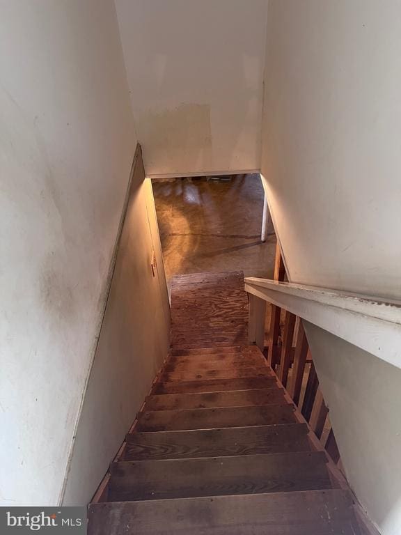  - stairway featuring hardwood / wood-style floors