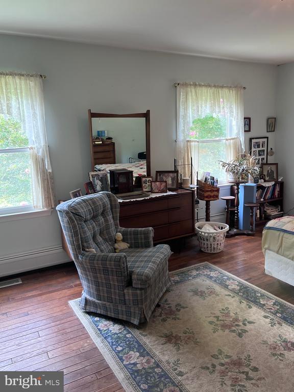  - office area with wood-type flooring