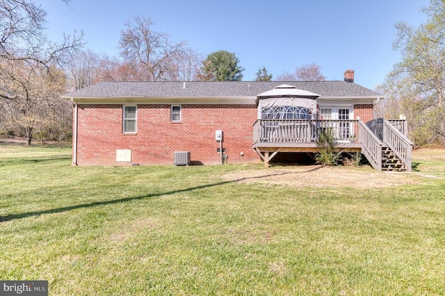 10119 Jameson Ln, Culpeper, VA 22701 - rear view of house featuring a deck, central AC unit, a chimney, a lawn, and brick siding