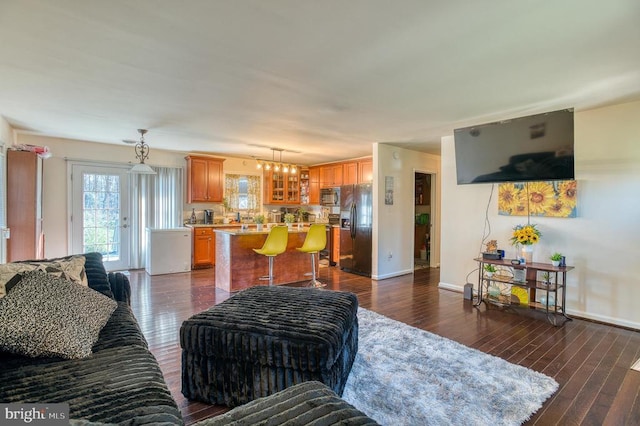 10119 Jameson Ln, Culpeper, VA 22701 - living area with baseboards, dark wood-style floors, and a chandelier