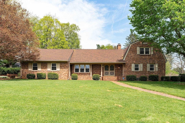 812 Meadowbrook Rd, Waynesboro, VA 22980 - view of front facade with a front lawn, brick siding, a shingled roof, a chimney, and a gambrel roof