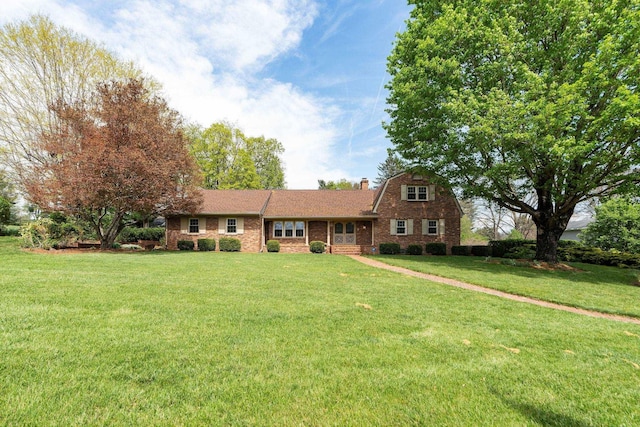 812 Meadowbrook Rd, Waynesboro, VA 22980 - view of front of home with a front yard, a chimney, and brick siding
