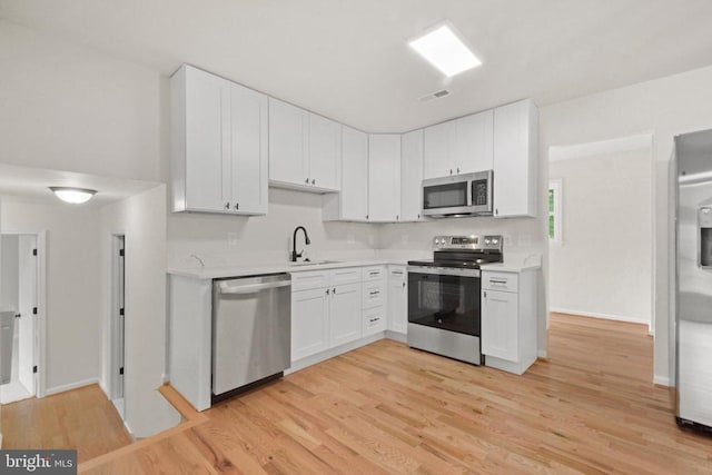 10909 Meadowlark Ln, Spotsylvania, VA 22553 - kitchen with appliances with stainless steel finishes, light countertops, and white cabinets