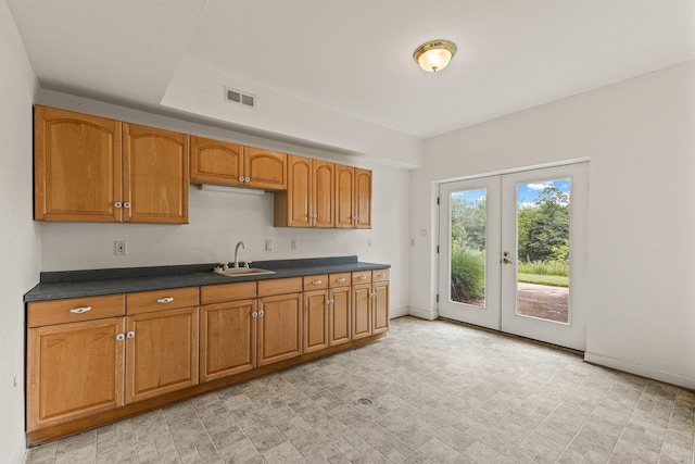 135 Meagans Run Rd, Woodstock, VA 22664 - kitchen featuring a sink, french doors, brown cabinets, and dark countertops