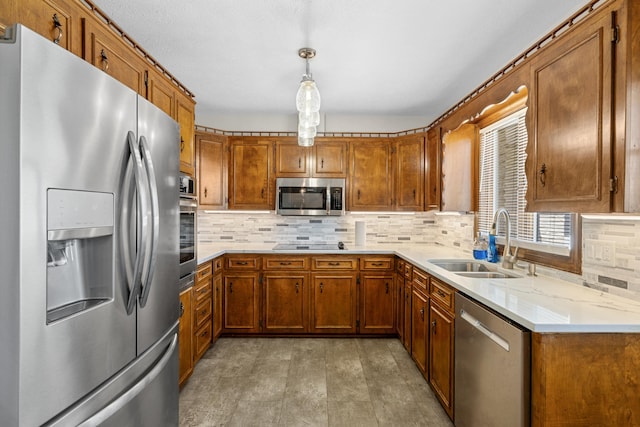 10304 Spotswood Trl, Mcgaheysville, VA 22840 - kitchen with stainless steel appliances, a sink, brown cabinetry, and tasteful backsplash