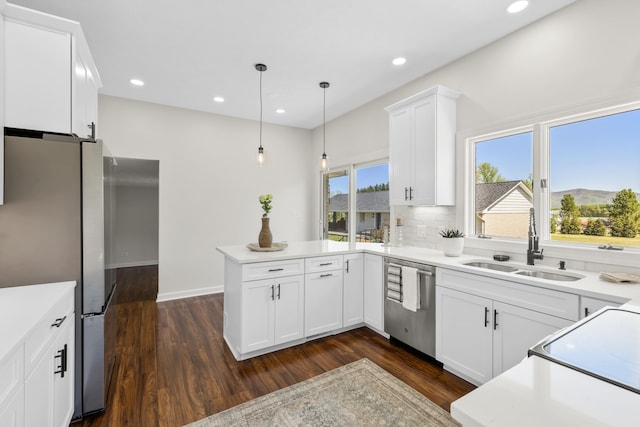 10304 Spotswood Trl, Mcgaheysville, VA 22840 - kitchen with appliances with stainless steel finishes, a sink, dark wood-style floors, a peninsula, and white cabinetry